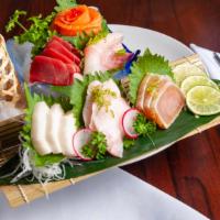 Sashimi Deluxe · 16 pieces of assorted raw fish.