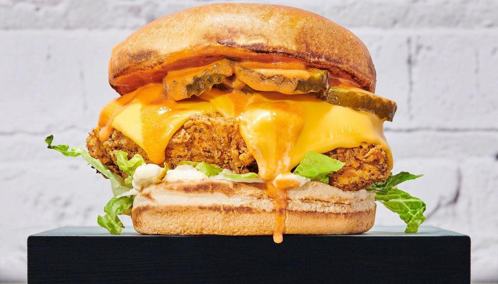 Flying Buffalo Chicken Sandwich · What could be better than breaded fried chicken smothered in buffalo sauce? With mayo, lettuce, pickles and cheese.