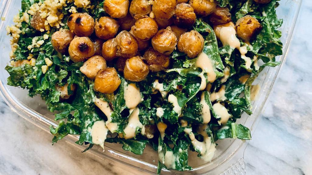 Kale Caesar Salad - 24Oz · Fresh kale massaged with our house-made vegan caesar dressing. Topped with crispy chickpeas, cashew 
