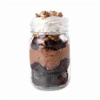 Chocolate Brownie Pudding Jar Dessert · Chocolate brownie, chocolate pudding, Heath bar, and whipped topping. *contains nuts