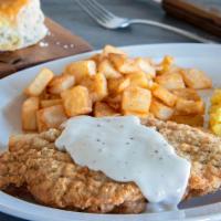 Country Fried Steak Breakfast · A tender steak coated in our signature seasoned flour, then topped with our traditional whit...