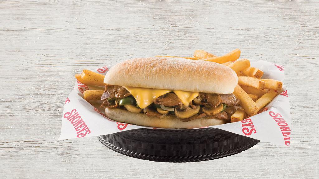 Philly Steak And Cheese Sandwich · Savory shaved ribeye grilled with bell peppers, sweet onions, and mushrooms, then smothered in American cheese and served on a toasted hoagie. Served with French fries.