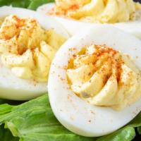 Deviled Eggs · Three halves of our southern-stye stuffed eggs.