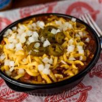 Homemade Chili · Chili is topped with cheddar cheese, diced onions and jalapeños.