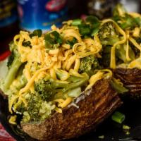 Broccoli Baker · Topped with broccoli, butter, sour cream, cheddar cheese, and scallions.