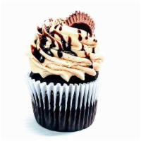 Peanut Butter Cup · Chocolate cake  with decadent peanut butter icing, drizzled with chocolate sauce and topped ...