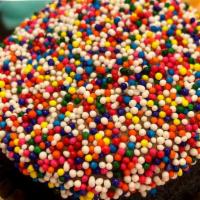 Chocolate Birthday Cake · Chocolate cake with chocolate buttercream topped with birthday sprinkles.