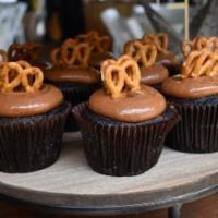 Caramel Crunch Cupcake · Chocolate or Vanilla cupcake with caramel frosting; topped with a salted pretzel.