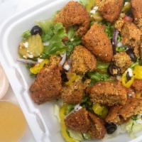 Falafel Salad · Latus, tomatoes, onion, pickle, banana pepper, cucumber, and falafel. Dressed with our speci...