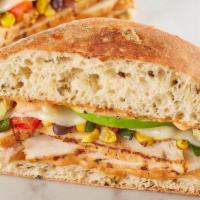 Spicy Southwest Chicken · Grilled chicken, roasted corn, poblano and black bean relish, pepper jack, avocado and chipo...