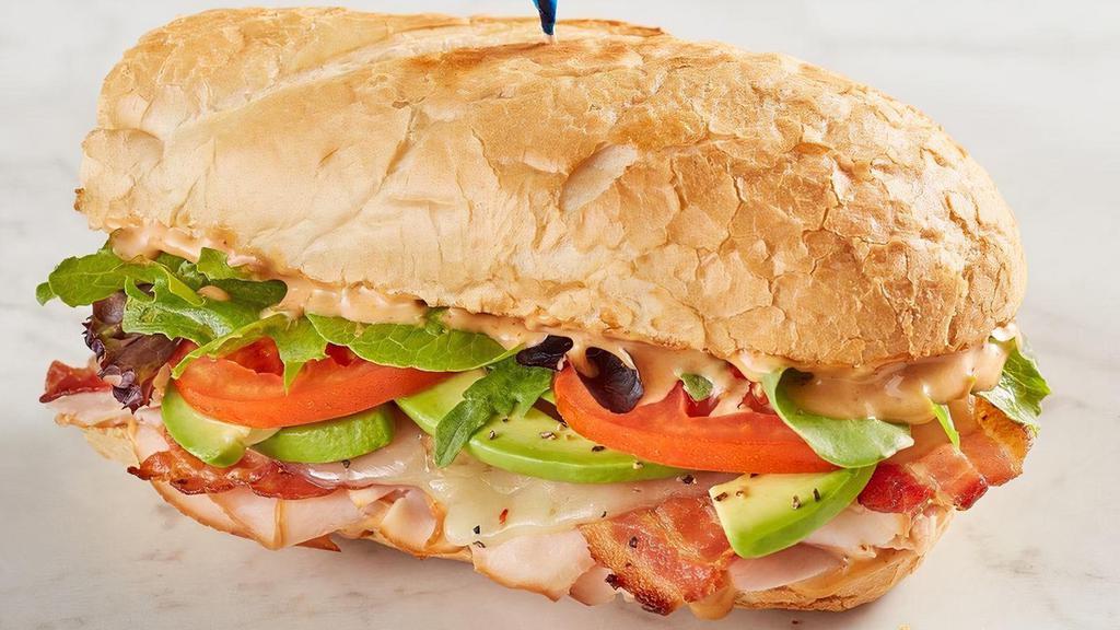 Spicy Turkey Melt · Smoked turkey, bacon, pepper jack, avocado, chipotle ranch, spring mix and tomato on toasted baguette.