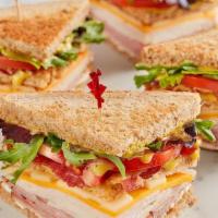 Mcalister'S Club · Smoked turkey, Black Forest ham, bacon, sharp cheddar, Swiss, spring mix, tomato, mayo and M...