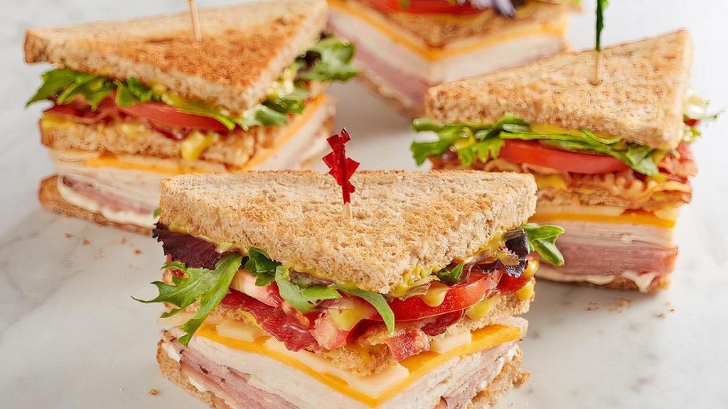 Mcalister'S Club · Smoked turkey, Black Forest ham, bacon, sharp cheddar, Swiss, spring mix, tomato, mayo and McAlister's Honey Mustard™ on wheat..