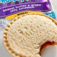 Smucker’S® Uncrustables® Pb&J · Grape jelly and peanut butter on crust-less wheat bread. Comes with your choice of a side an...