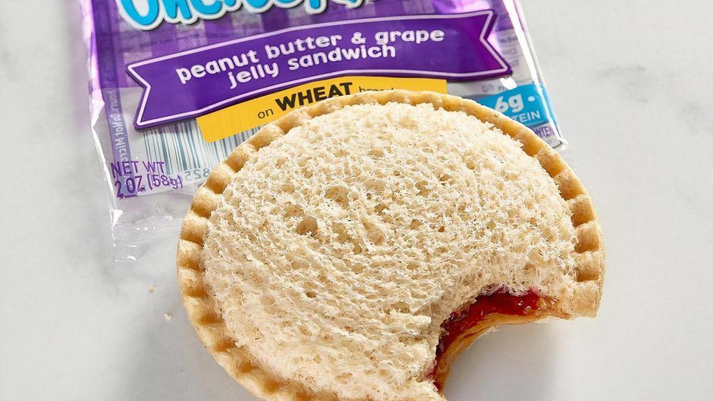 Smucker’S® Uncrustables® Pb&J · Grape jelly and peanut butter on crust-less wheat bread. Comes with your choice of a side and a Mini Chocolate Chip Cookie.