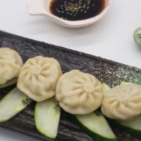 Mini Chicken Bun · Steamed dumpling filled with chicken and vegetable served with source
