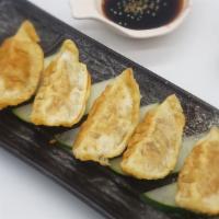 Chicken Dumplings · Chicken and cabbage filled dumplings served with sauces
