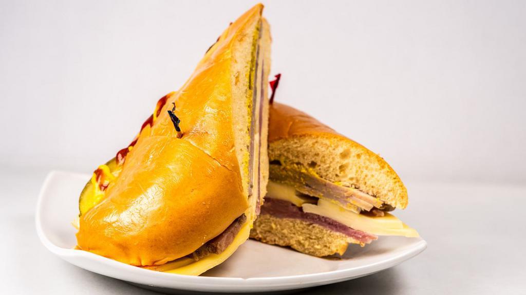 Media Noche · Ham, swiss cheese, piece of pork with mayo on potato bread