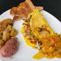 Atlanta Omelette · Stuffed With Lemon Grass Marinated Shrimp, Chives, Tarragon, Shallots and Garlic. Topped wit...