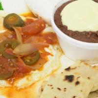 Huevos Rancheros · Two eggs topped with our delicious homemade ranchero sauce.
