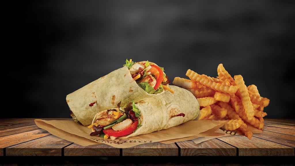Magoo'S Wrap  · Your choice of tenders, built on a flour tortilla, filled with mixed greens, sliced tomatoes, cheddar-jack cheese, and our signature Magoo's sauce. Served with our original crinkle cut fries.