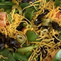 Greek Salad · Lettuce, onion, black olives, feta cheese, pepperoncinis.