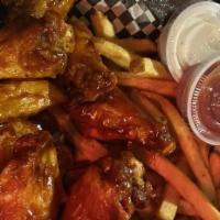 Escobar Wings & Fries · Wings and fries served with your choice of flavor.