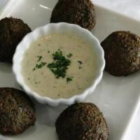 Falafel (V&Gf) · 5 golden brown pieces of homemade felafel made with ground chickpeas, spices and herbs, serv...