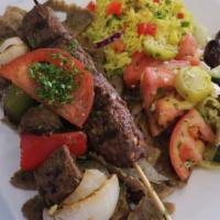 Combination Feast · 1 shish kebab, 1 kofta kebab and a serving of gyro meat, served with any 2 sides of your cho...