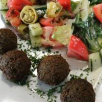 Falafel Plate (V) · 4 Pieces of falafel served with any 2 sides of your choice, pita bread and tahini sauce.
