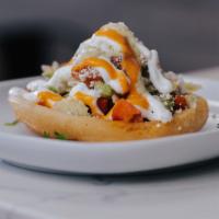 Sopes · Thick corn tortilla with refried beans and your choice of meat topped with sour cream, lettu...