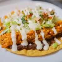 Tostadas · Flat corn tortilla deep-fried with fried & Choice of Protein, topped with beans, lettuce, to...
