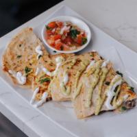 Quesadillas · Flour tortilla folded and stuffed with cheese * add your choice of protein (+$1.50): chicken...