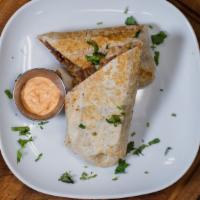 Burritos · Wrap of flour tortilla stuffed with grilled steak, al pastor meat or shredded chicken; beans...
