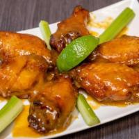 Wings (6 Pieces) · Unbreaded chicken wing cooked deep fried then coated with the sauce of your choice: Buffalo,...