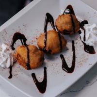 Fried Oreos · 3 pcs drizzled w/ chocolate & a dash of cinnamon