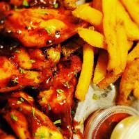 Wings · 10 fried wings with choice of fries or onion rings mild, hot, lemon pepper, teriyaki, spicy ...