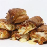 Pep-N-Rollie · Home-made dough stuffed with pepperoni & mozzarella - Stoner style! Served with marinara.