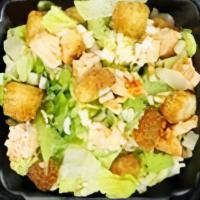 Half Caesar · Fresh-cut romaine lettuce, with aged parmesan cheese & croutons with creamy Caesar dressing.