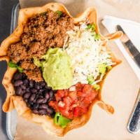 Taco Salad · Crispy tortilla bowl, ground beef, black beans, Mexican three cheese blend, salsa, and guaca...