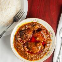 Suppa Kandja · Chopped okra stew with smoked turkey, fresh/smoke and stockfish, cow feet, and palm oil. Ser...