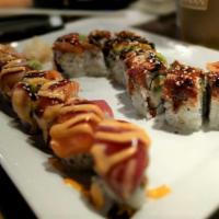 Jack Roll · Spicy tuna, crab stick, topped with four kinds of fish, avocado, spicy mayo and eel sauce.