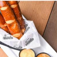 Edsel'S Hot Pretzels · Deep fried, salted soft pretzels served with cheese and honey mustard dipping sauces.