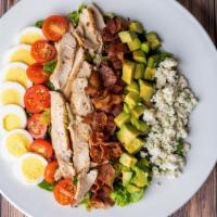 Grilled Chicken Cobb Salad · Grilled chicken with mixed greens tossed in a roasted garlic red wine vinaigrette with bacon...