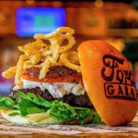 The Estate Burger · Half pound of grilled black angus, smoked gouda cheese, sweet red onion marmalade, arugula, ...