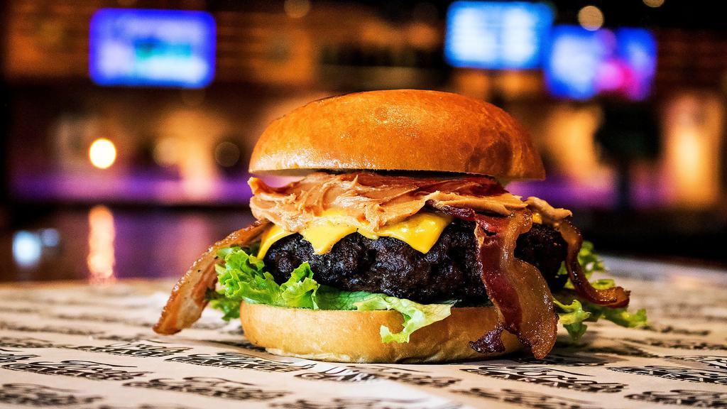 The Jiffy Burger · Half pound of grilled black angus, american cheese, applewood smoked bacon, lettuce, and creamy peanut butter on a brioche bun.