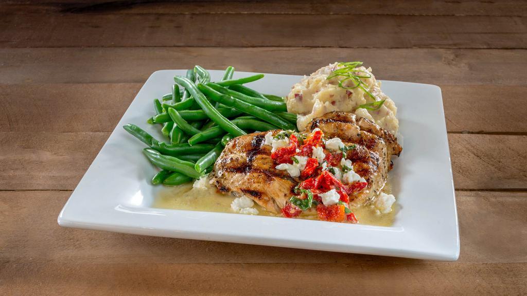 Chicken Henry · Grilled Marinated Chicken Breast, Topped with Our Chardonnay Lemon Butter Sauce, Goat Cheese,
Basil, and Sun-Dried Tomatoes, Served with a Choice of Two Sides