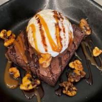 Turtle Brownie · Fudge Brownie with 
Vanilla Icecream, Caramel Sauce, Hershey's Chocolate Sauce and Candied W...