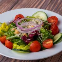 Side House Salad · Mixed greens with tomatoes, onions, chickpeas, and cucumbers with Parmesan cheese.