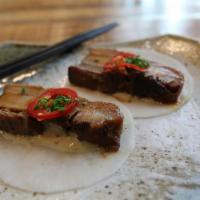 Chashu Wrap. · Pickled radish | Pork chashu | Umami mayo | Chives | Rayu | Red Chilis